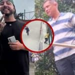 Dos velas encendidas junto a flores blancas en un altar improvisado en Bogotá.