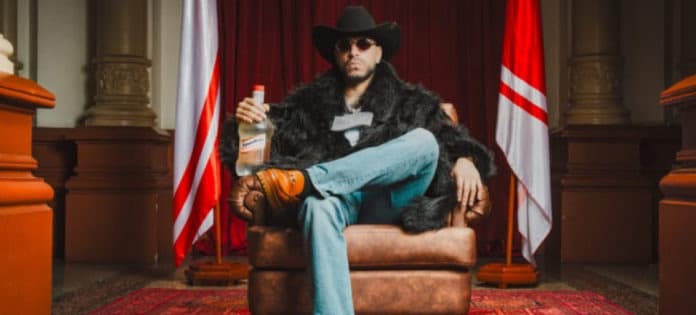 Ryan Castro en el escenario del Atanasio, luces brillantes y público animado.