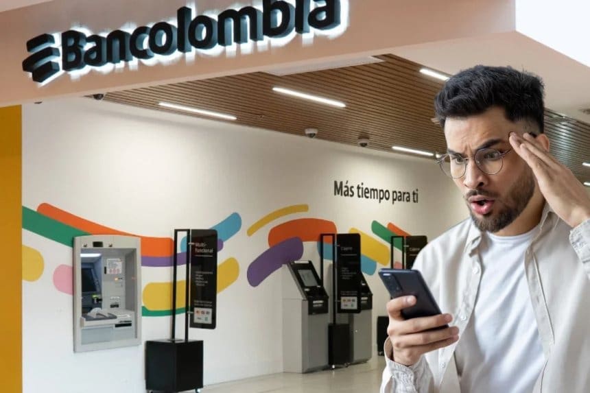 Logo de Bancolombia en una pantalla de computadora con fondo de oficina.