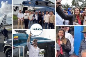Santiago Botero en un evento electoral, rodeado de simpatizantes, con un banner de campaña en el fondo.