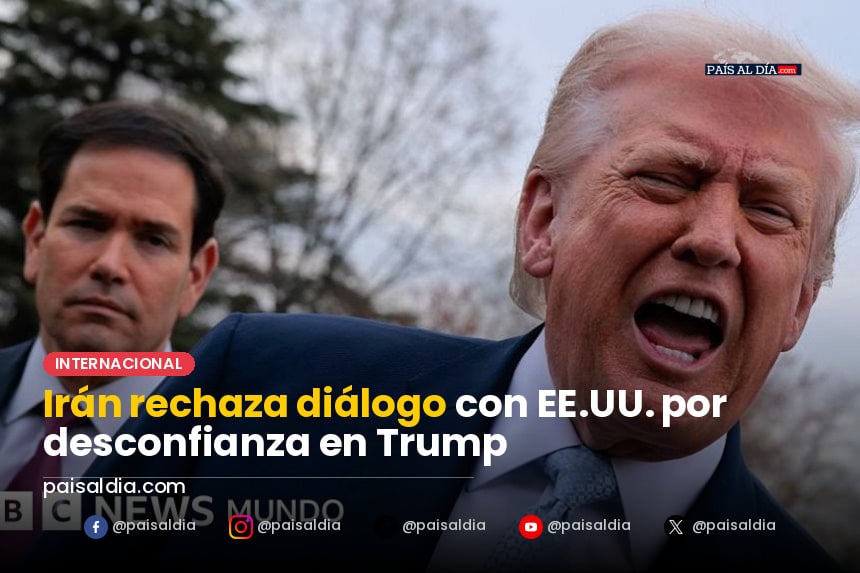 Un funcionario iraní en conferencia de prensa, con banderas de Irán y EE.UU. al fondo, expresa la negativa a dialogar.