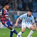 Jugadores de Racing Club se lamentan tras el tercer gol de Botafogo.